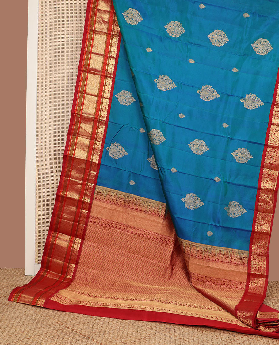 Blue zari buttas silk saree, contrast border of rekku,muthu,mayil,yaanai,rudraksham & ara maadam & circular motifs woven pallu