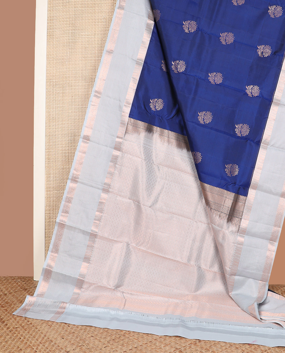 Blue floral zari buttas silk saree, contrast border of thilakam, muthu, ara maadam, kuyil kann, and vanki designs, and jaal pallu
