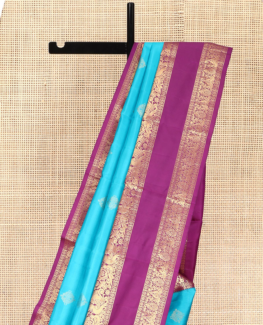Blue Vasundhara Lite Silk Mix Saree, Detailed with Zari Buttas on Its Body, Complemented by a Contrast Zari Border of Rekku, Kamalam, and Mayil Designs, Grandly Scallop Design Pallu, and Paired with a Contrast Blouse