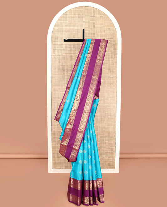 Blue Vasundhara Lite Silk Mix Saree, Detailed with Zari Buttas on Its Body, Complemented by a Contrast Zari Border of Rekku, Kamalam, and Mayil Designs, Grandly Scallop Design Pallu, and Paired with a Contrast Blouse