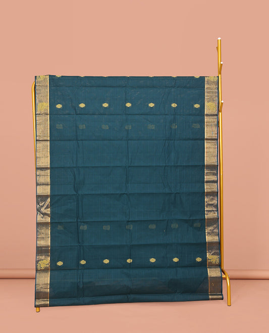 Blue Kanchi Cotton Saree, Embellished with Buttas on Its Body, a Subtle Zari Border, Pallu of Intricate Designs, and Paired with a Matching Blouse