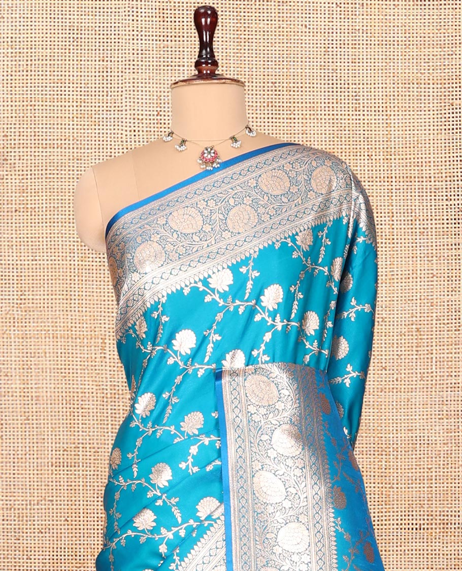 Light Blue Banarasi Nylon Saree, Detailed with Jacquard, a Floral Creeper Zari Border, Intricate Pallu, and a Matching Blouse