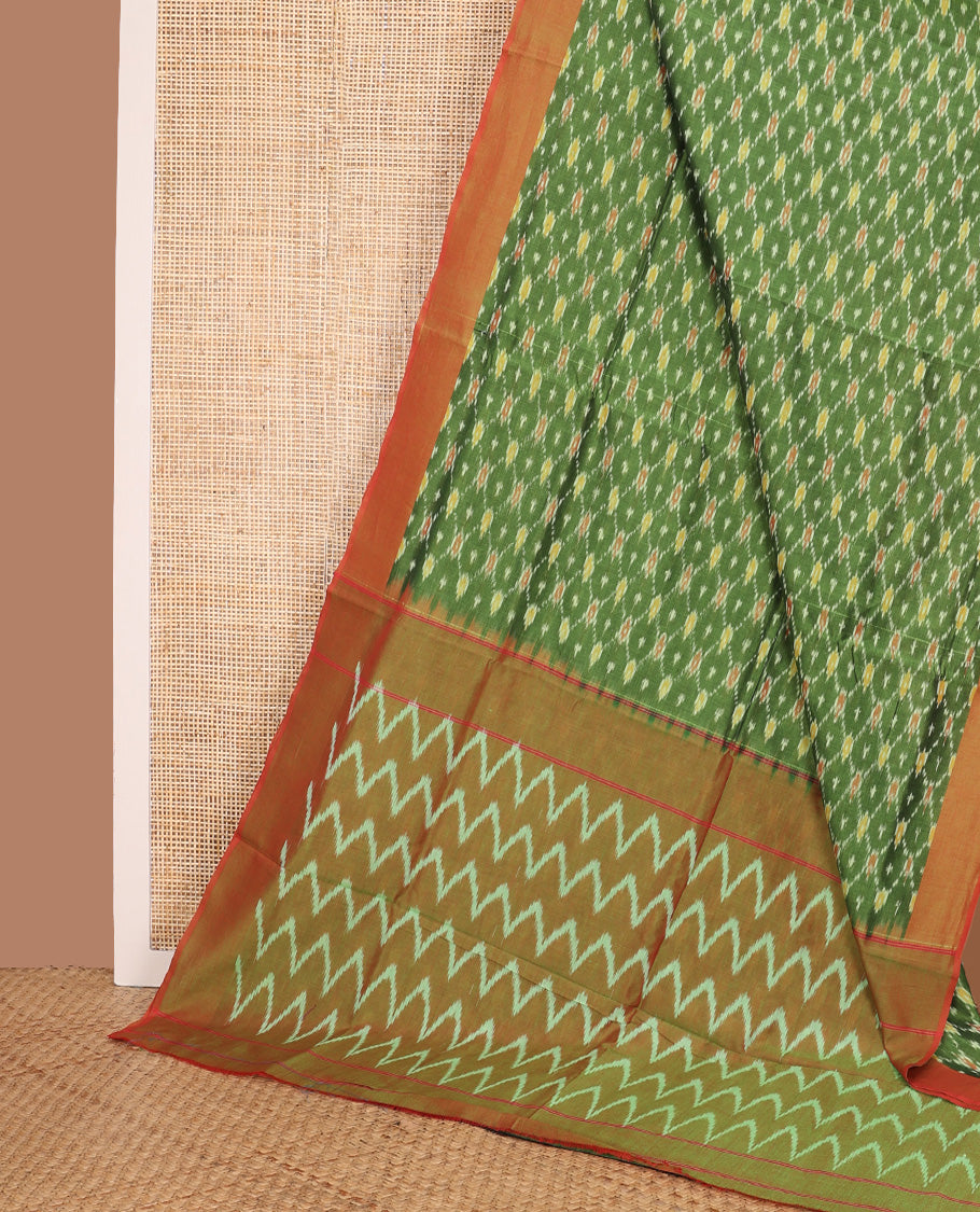 Green ogee patterned ikkat cotton saree, contrast plain border, and chevron striped pallu