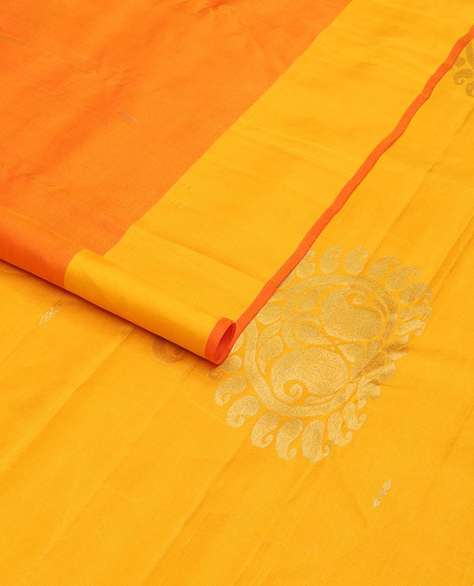 Orange zari buttas Kanchipuram silk saree, contrast floral design border, and pallu of manga designs