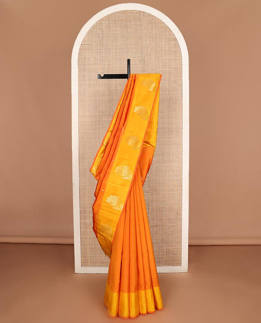 Orange zari buttas Kanchipuram silk saree, contrast floral design border, and pallu of manga designs