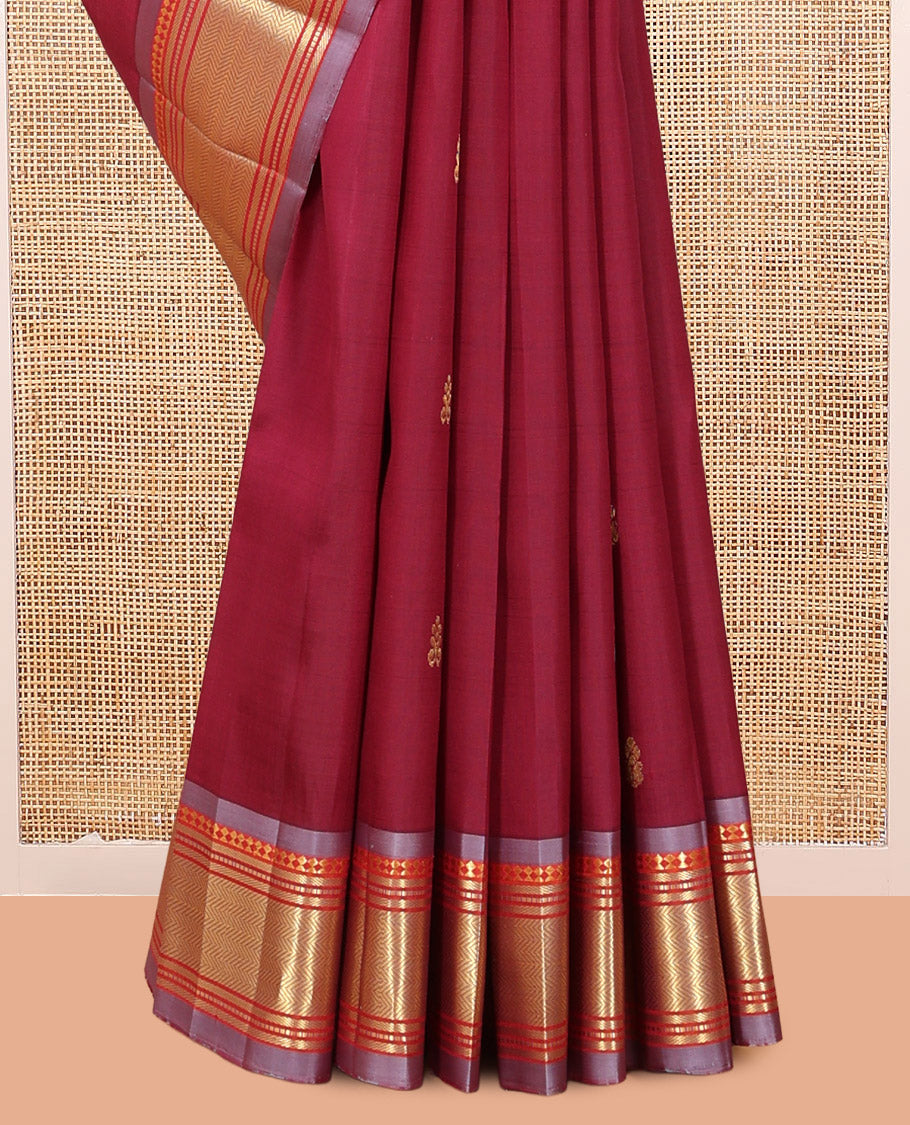 Maroon Kanchipuram Silk Saree, Ornamented with Zari Buttas, Complemented by a Contrast Border of Panner Sombu, Banaras, Muthu, and Vanki Design, Zari Design Pallu, and No Blouse