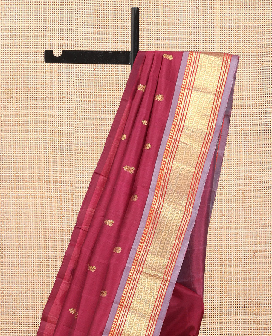 Maroon Kanchipuram Silk Saree, Ornamented with Zari Buttas, Complemented by a Contrast Border of Panner Sombu, Banaras, Muthu, and Vanki Design, Zari Design Pallu, and No Blouse