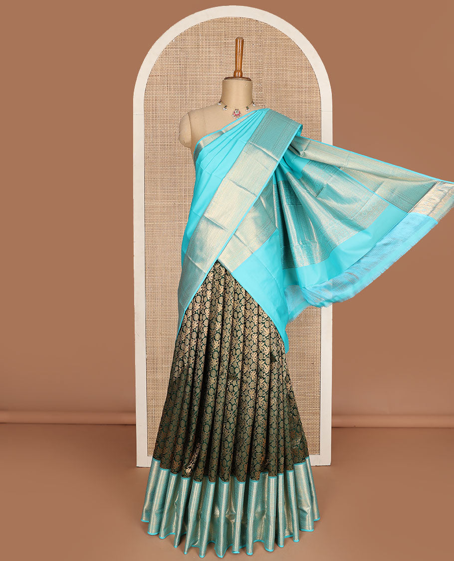 Green pure-silk half-saree, jacquard skirt, contrast blouse, and border of thilakam, banaras, poun, diamond, cross kamalam, and then kuli kann designs, and intricate dhavani
