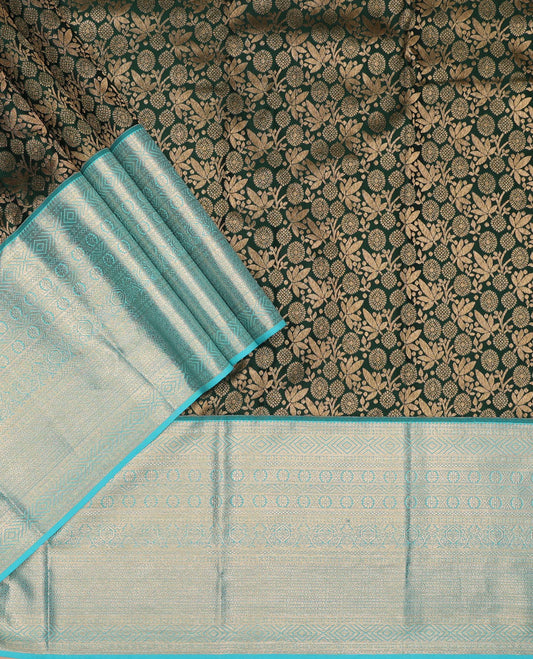 Green pure-silk half-saree, jacquard skirt, contrast blouse, and border of thilakam, banaras, poun, diamond, cross kamalam, and then kuli kann designs, and intricate dhavani