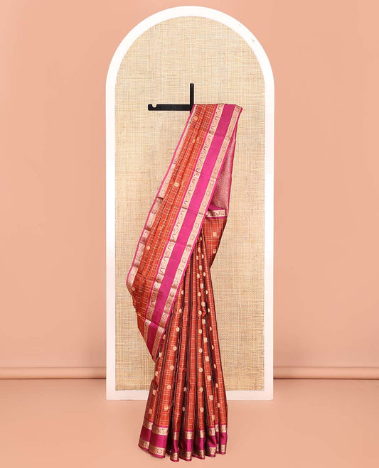Orange Vasundhara Lite SilkMix Saree, Accentuated with Mayil Chakram Butta Enclosed Checked Design, Complemented by a Contrast Rettai Pettu Border of Thazampoo Rekku, Mayil, and Kamalam Designs, Geometric Patterned Pallu, and Paired with a Contrast Blouse