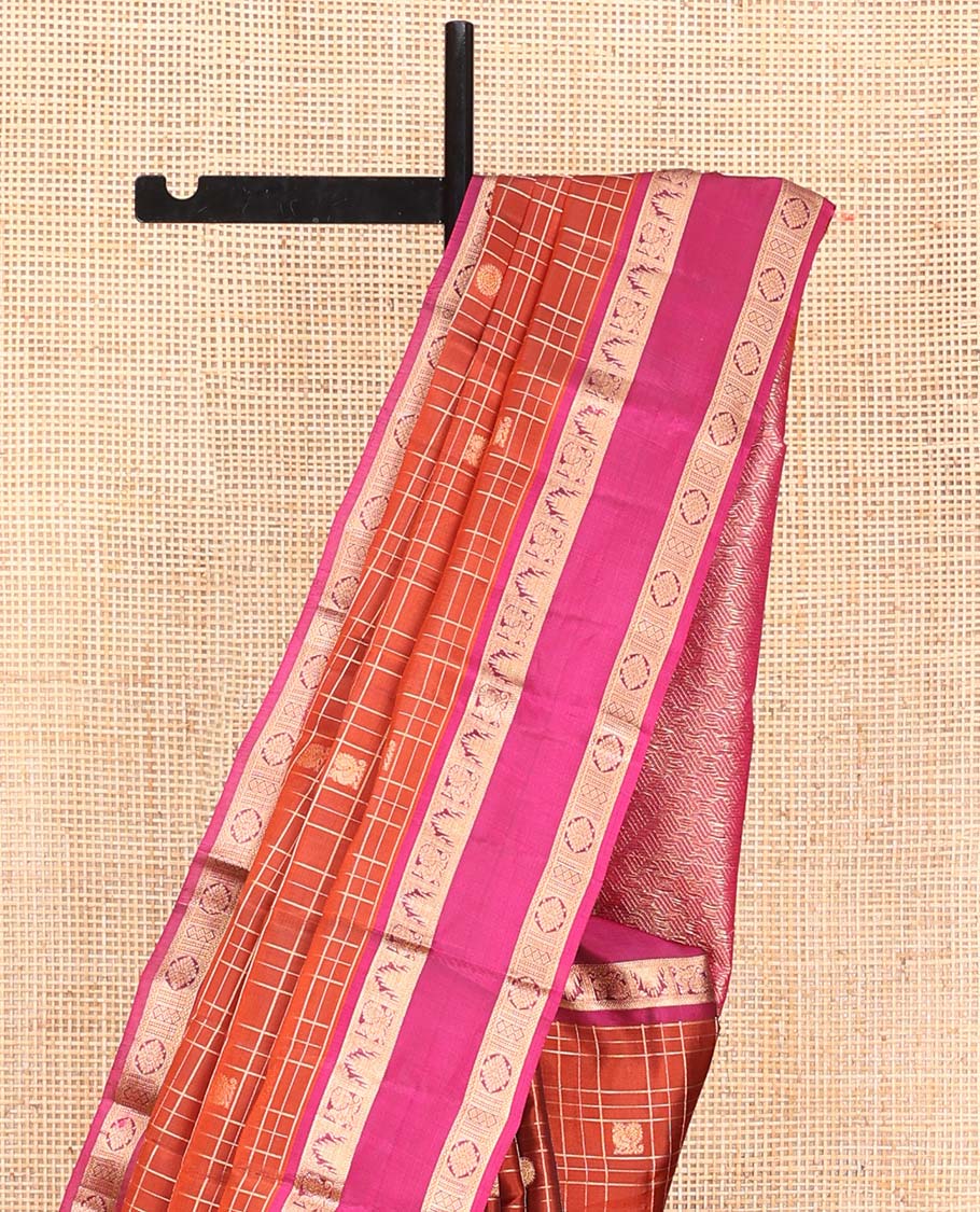 Orange Vasundhara Lite SilkMix Saree, Accentuated with Mayil Chakram Butta Enclosed Checked Design, Complemented by a Contrast Rettai Pettu Border of Thazampoo Rekku, Mayil, and Kamalam Designs, Geometric Patterned Pallu, and Paired with a Contrast Blouse