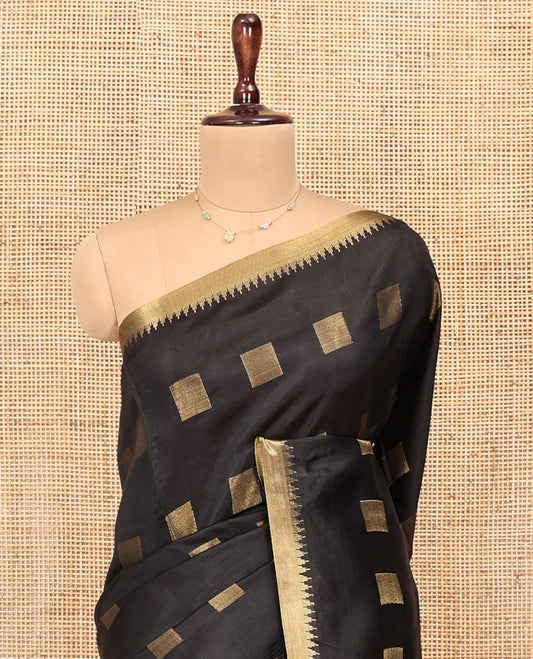 Black Banana Pith Saree, Beautified with Square Buttas All Over Its Body, Subtle Zari Temple Border, Pallu Steeped with Stripes, and Paired with a Matching Blouse
