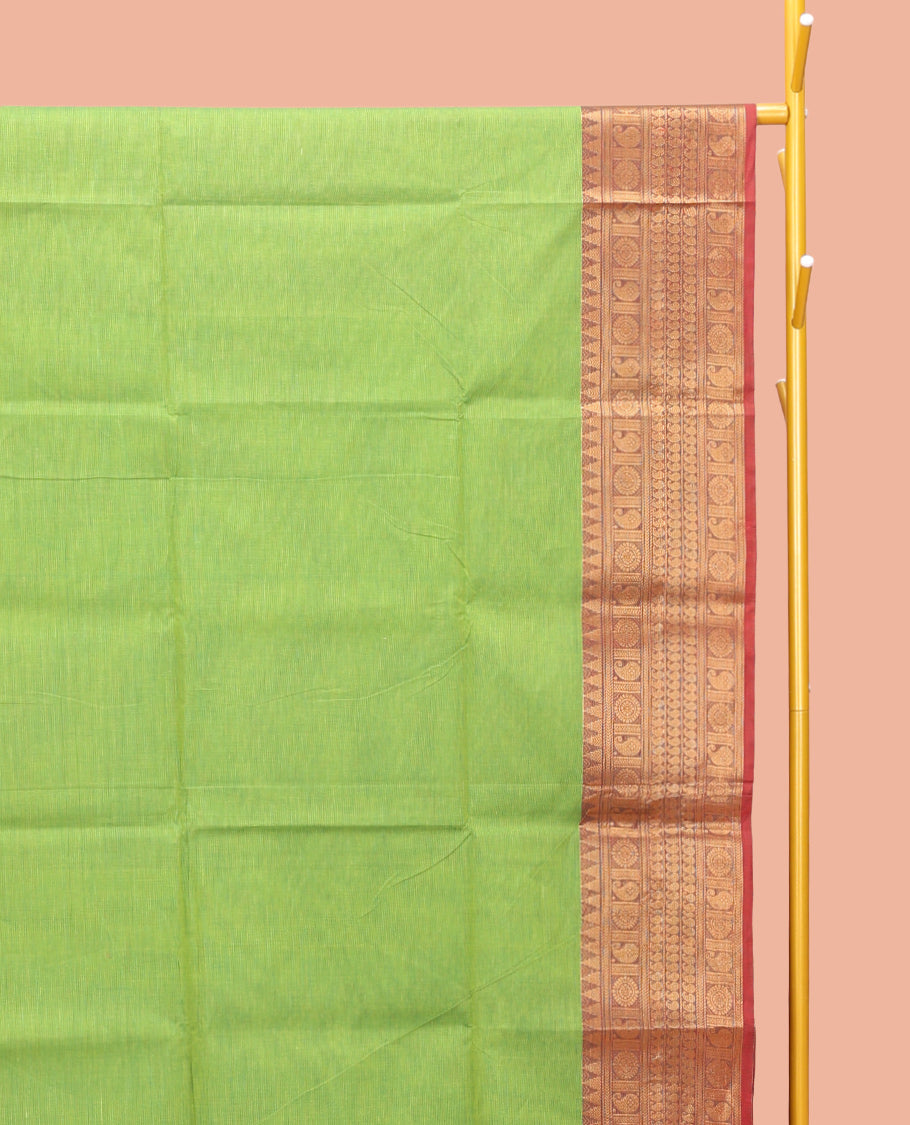 Parrot Green Plain Chettinad Cotton Saree, Complemented by a Contrast Traditional Zari Design Woven Border, Pallu of Stripes, and Paired with a Matching Blouse