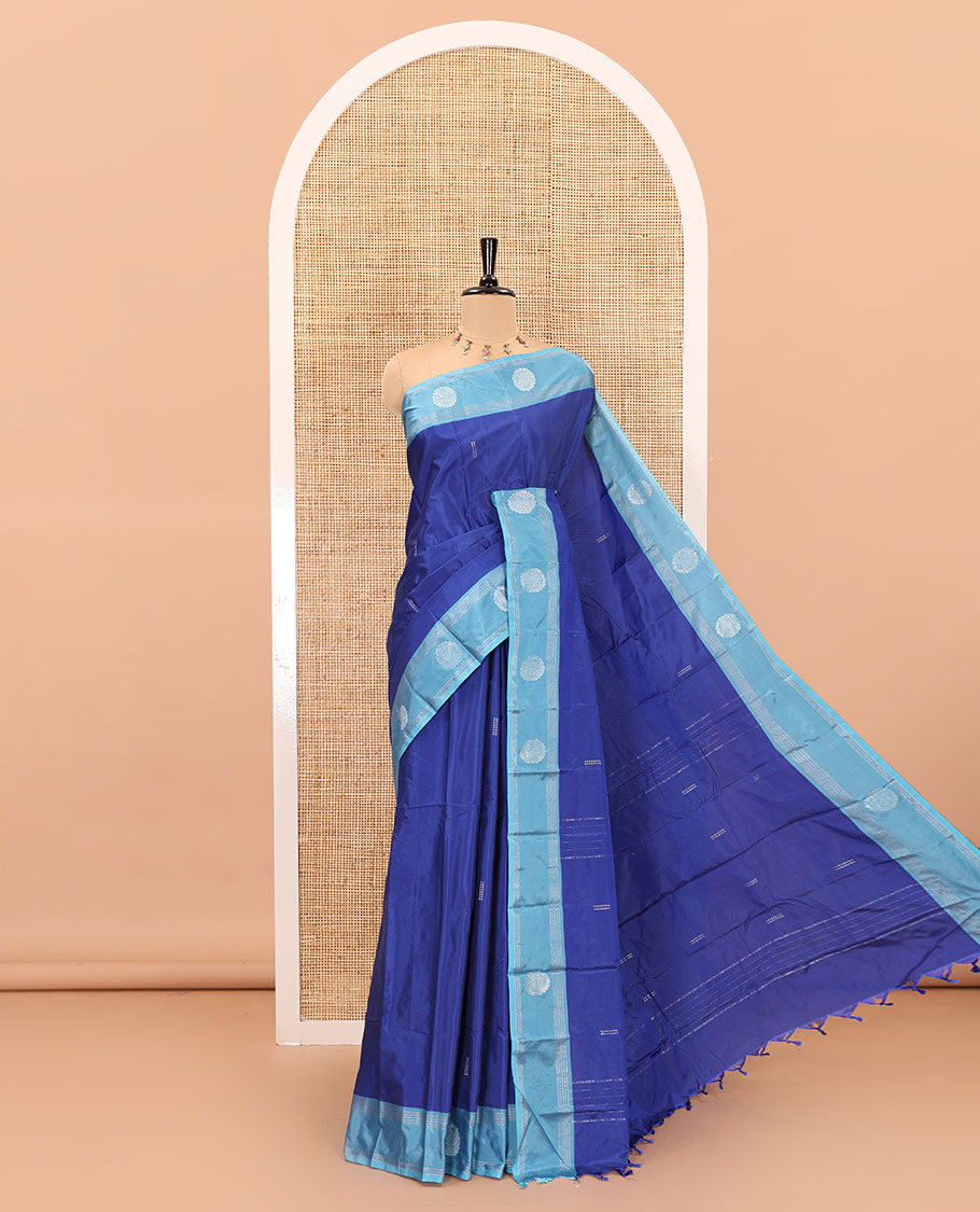 Royal blue zari buttas semi-soft silk saree, contrast thazampoo rekku zari buttas and striped border, striped pallu, and a plain blouse
