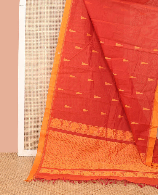 Red Kanchi Cotton Saree, Highlighted by Temple Buttas All Over Its Body, Complemented by a Contrast Border, Pallu Depicts Intricate Designs, and Paired with a Matching Blouse