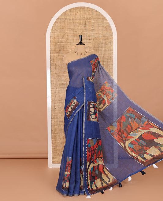Indigo blue plain linen cotton saree, mordern art style elephant motifs printed border, elephant printed pallu, and a contrast floral vine printed blouse