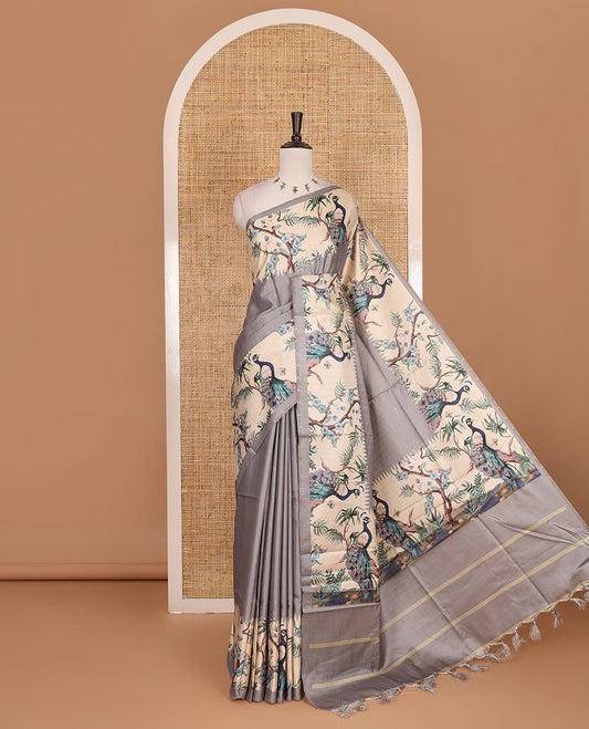Grey gold zari dotted buttas semi tussar saree, contrast temple border features peacocks on the brand design print, striped pallu, and printed blouse