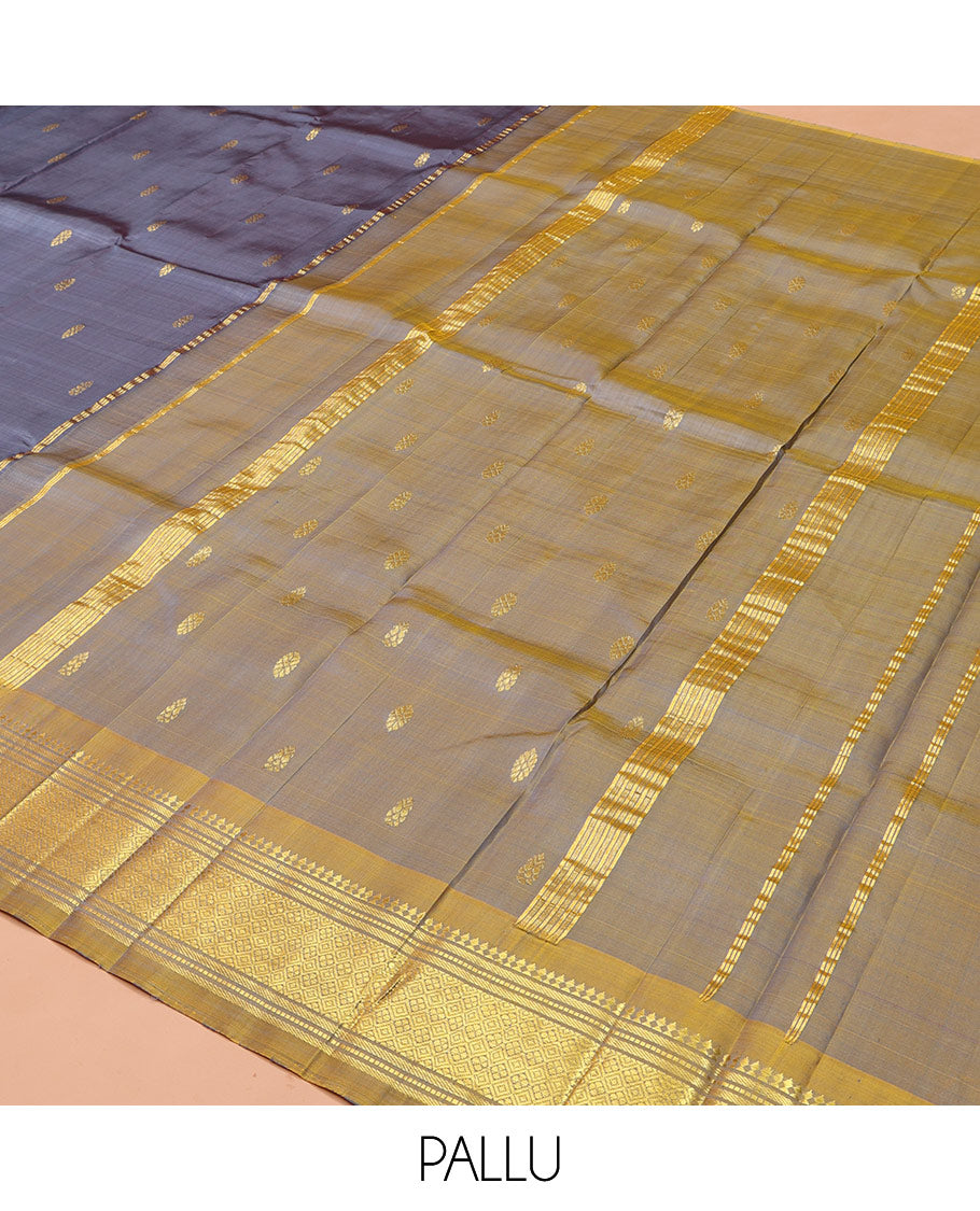 Grey Kanchipuram Silk Saree, Graced with Zari Buttas on Its Body, Complemented by a Contrast One-Sided Border of Panner Sombu, Banaras, Muthu, and Jaal Designs, Pallu of Zari Designs, and Comes Without a Blouse