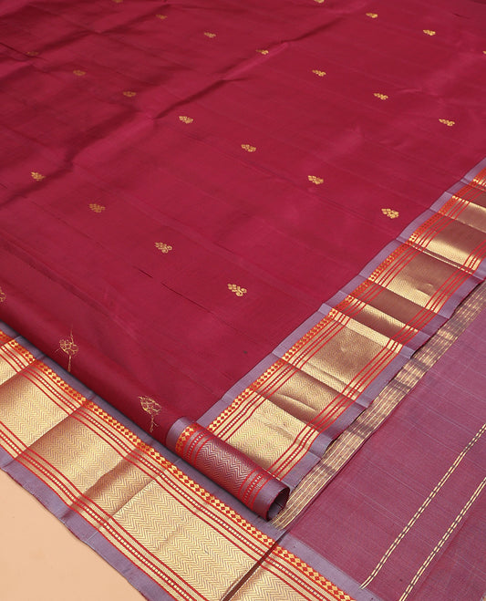 Maroon Kanchipuram Silk Saree, Ornamented with Zari Buttas, Complemented by a Contrast Border of Panner Sombu, Banaras, Muthu, and Vanki Design, Zari Design Pallu, and No Blouse