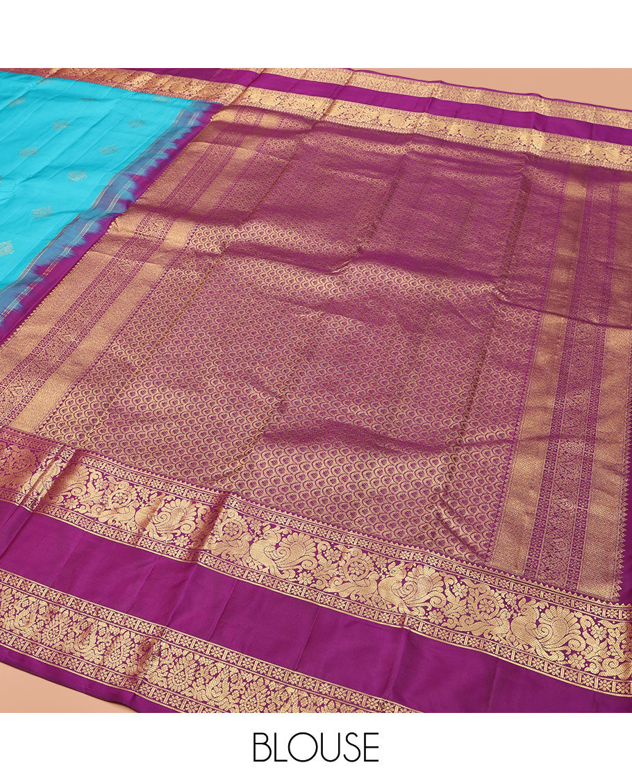 Blue Vasundhara Lite Silk Mix Saree, Detailed with Zari Buttas on Its Body, Complemented by a Contrast Zari Border of Rekku, Kamalam, and Mayil Designs, Grandly Scallop Design Pallu, and Paired with a Contrast Blouse