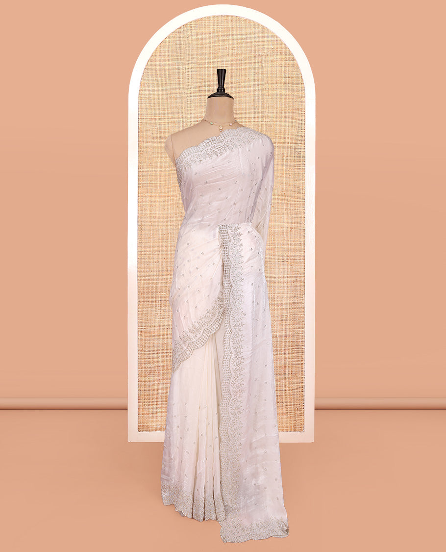 White Designer Saree, Enthralled with Stone Work All Over Its Body, a Scallop Stone Embroidered Border, and Matching Blouse