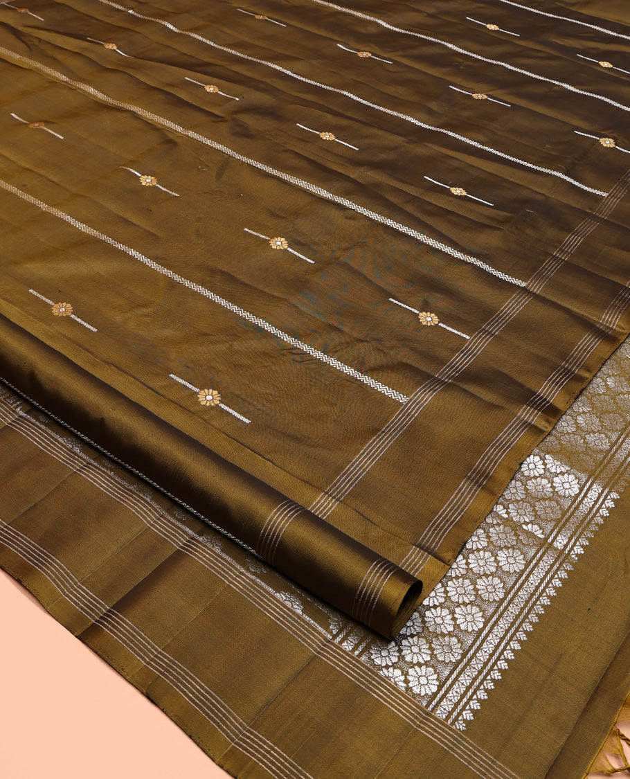 Green Mayuri Soft Silk Saree, Graced with Zari Buttas All Over Its Body, Highlighted by Zari Striped Border, Pallu Steeped with Zari Buttas, and Paired with a Matching Blouse