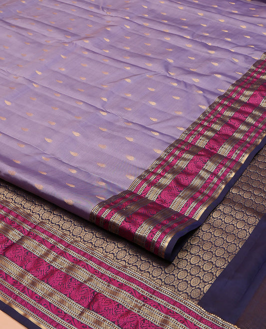 Lavender Vasundhara Lite Silk Mix Saree, Embellished with Zari Buttas on Its Body, Complemented by a Contrast Border of Rekku, Muthu, and Kodi Visiry Designs, Pallu Steeped with Chakram Designs, and Paired with a Contrast Blouse