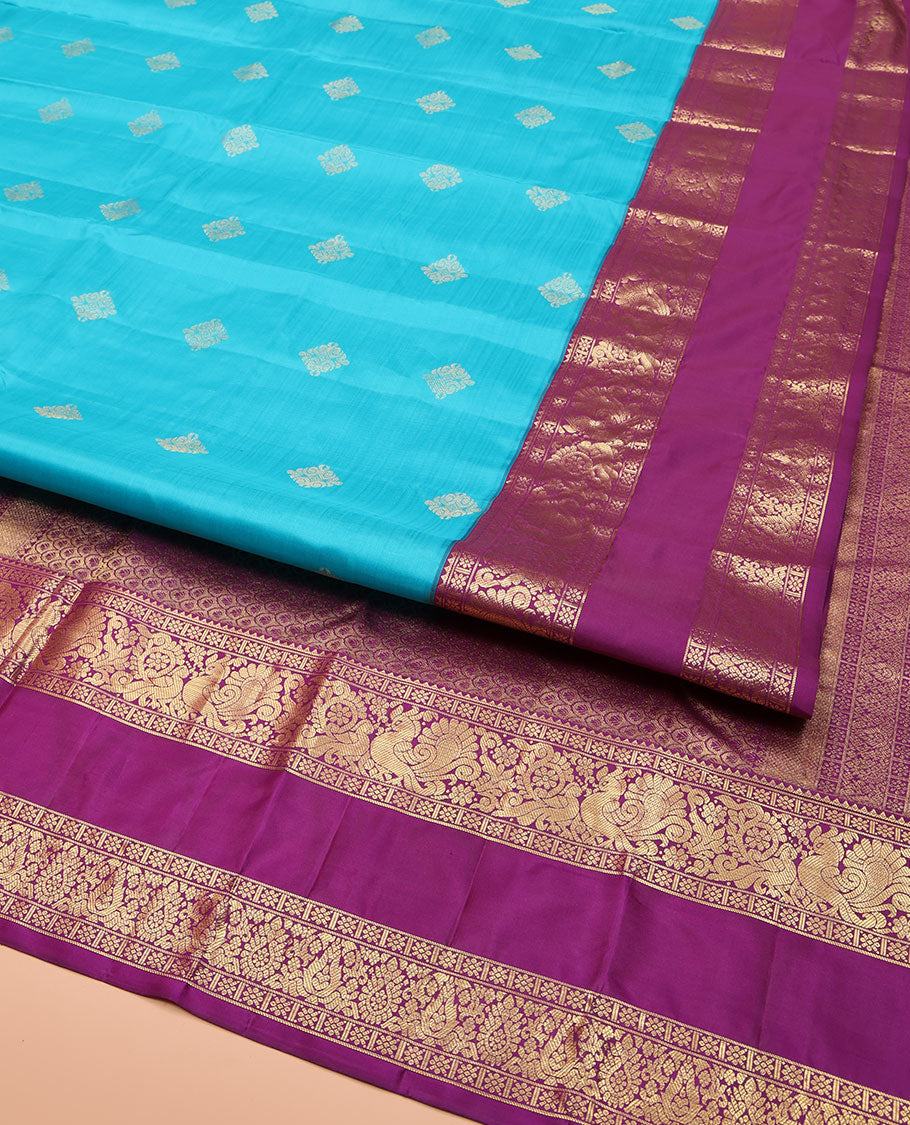 Blue Vasundhara Lite Silk Mix Saree, Detailed with Zari Buttas on Its Body, Complemented by a Contrast Zari Border of Rekku, Kamalam, and Mayil Designs, Grandly Scallop Design Pallu, and Paired with a Contrast Blouse