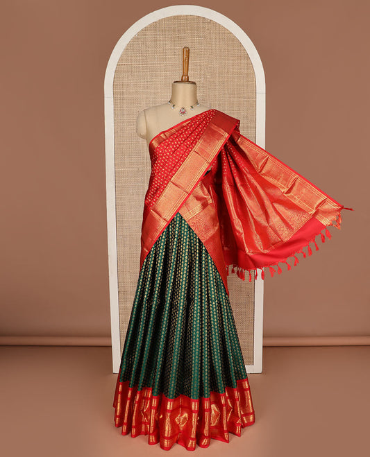 Green puresilk halfsaree, zari buttas skirt, contrast rettai pettu border, blouse of thilakam mokku, kathir, muthu, and mayil design, and zari woven pallu
