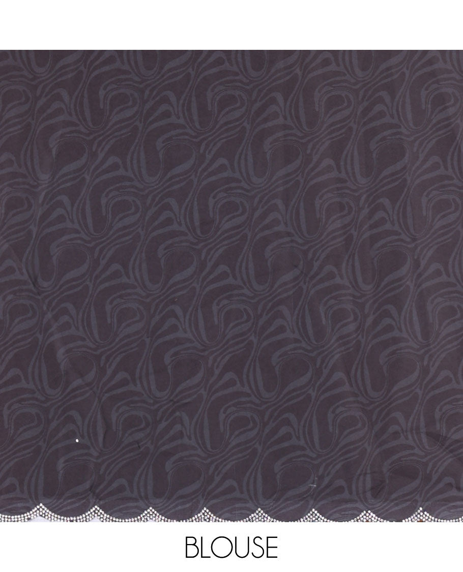 Cream and black abstract printed satin crepe saree, scallop jarkan stone work border, self-pallu, and a contrast printed blouse