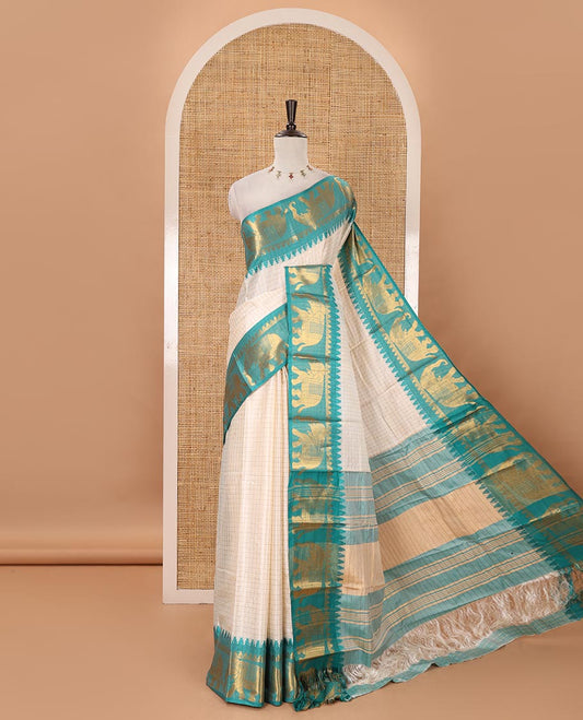 White checked semi-tafeta saree, contrast temple zari elephant motifs blue color border, zari-rich pallu & contrast checked zari border blouse