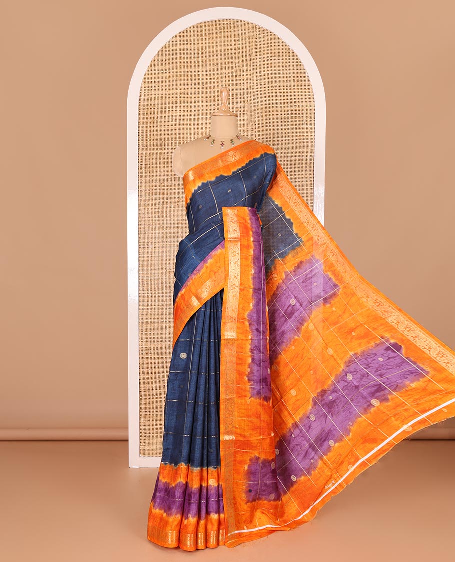 Blue buttas enclosed checked dola silk saree, contrast shibori print with traditional zari border, buttas enclosed checked pallu, and a contrast buttas enclosed checked blouse