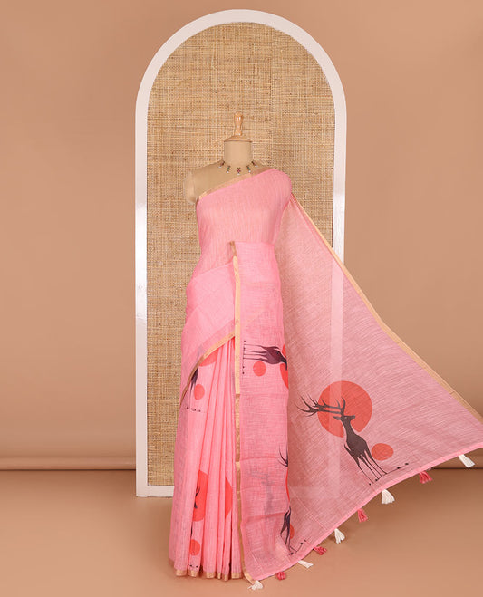 Pink sun and deer silhouette printed linen cotton saree, gold zari piping border, printed pallu, and a matching stripes printed blouse