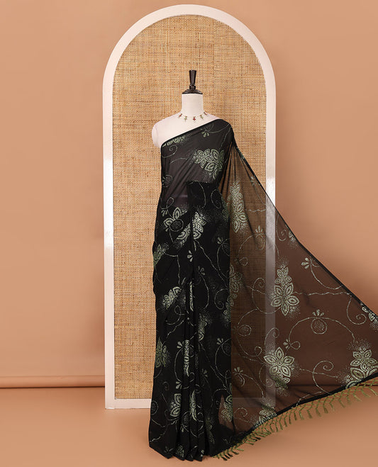 Borderless black 60 gm georgette saree features floral vine designs red glitter embroidery work, contrast plain blouse