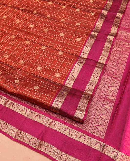 Orange Vasundhara Lite SilkMix Saree, Accentuated with Mayil Chakram Butta Enclosed Checked Design, Complemented by a Contrast Rettai Pettu Border of Thazampoo Rekku, Mayil, and Kamalam Designs, Geometric Patterned Pallu, and Paired with a Contrast Blouse