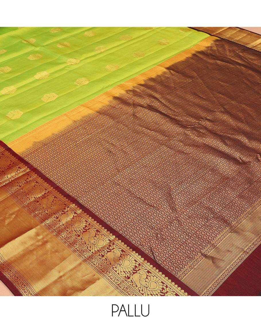 Green Vasundhara Silk Saree, Woven with Zari Buttas, a Contrast Border of Neli, Mayil, Kodi Visiry, and Vanki Designs, Grand Pallu, and a Contrast Blouse