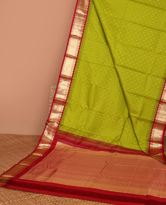 Green buttas silk saree, contrast border of rekku,banaras & jaal & pallu of ogee pattern