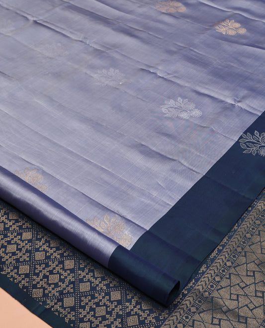 Grey Mayuri Lite Silk Mix Saree, Sparsely Woven with Zari Buttas All Over Its Body, Complemented by a Contrast Border of Floral Designs, Pallu of Jaal Designs, and Paired with a Contrast Blouse