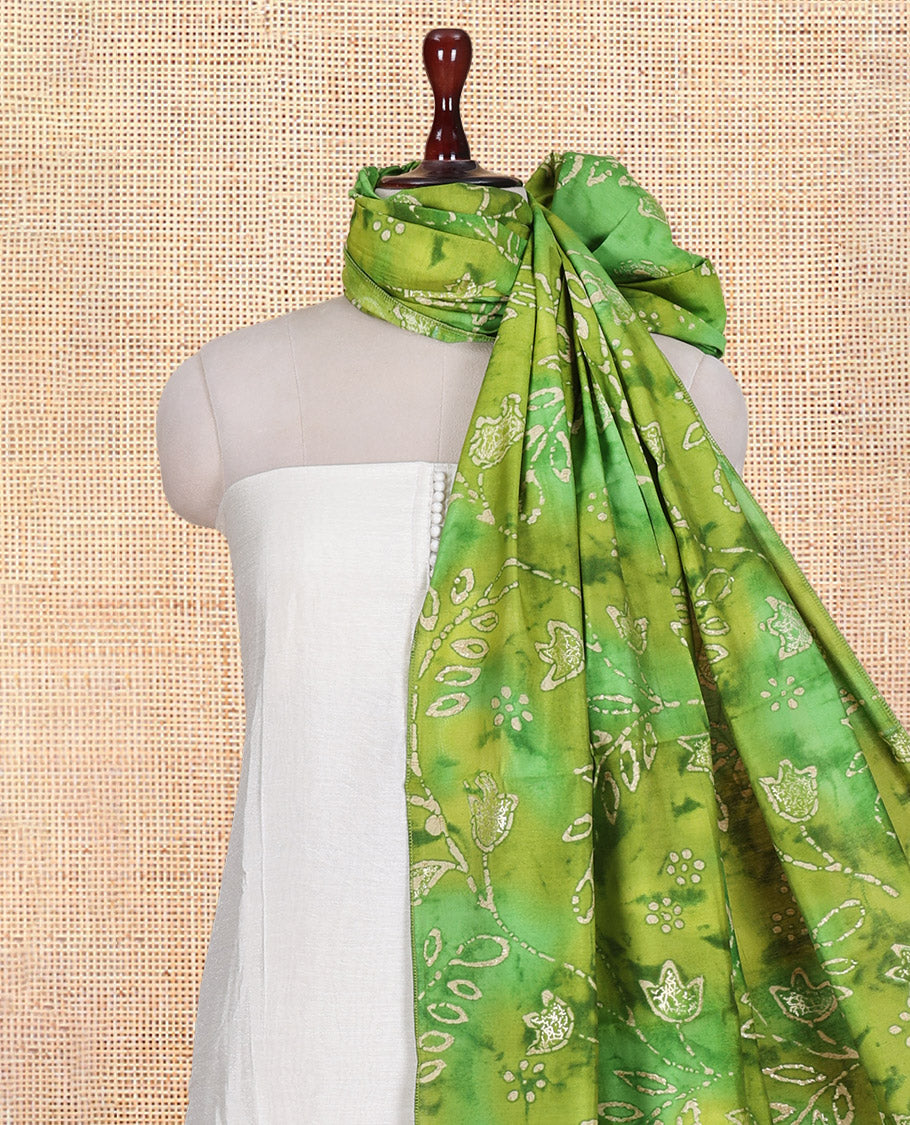 Cream-Green Kerala Cream Mul Chanderi Material Churidar Features Pom-Pom Neckline Top, a Contrast Batik Floral Printed Bottom, and  Dupatta