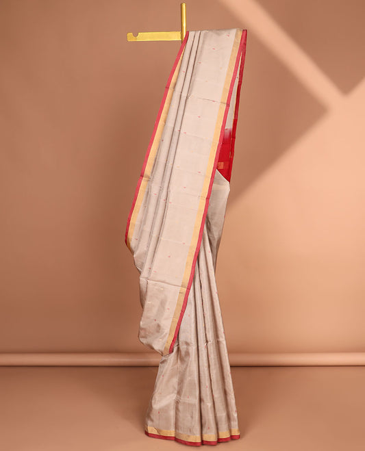 Beige uppada saree with unique buttas, contrast plain border & pallu of floral jaal designs