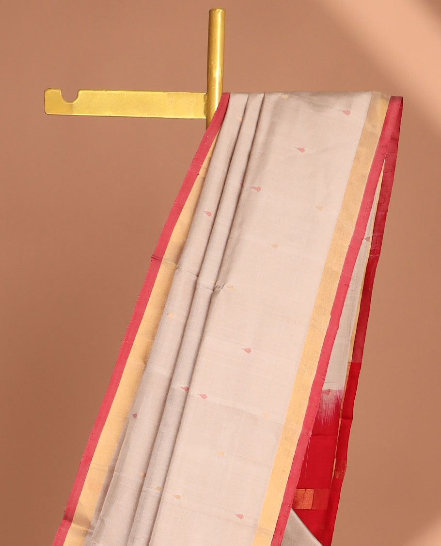 Beige uppada saree with unique buttas, contrast plain border & pallu of floral jaal designs