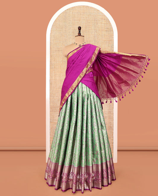 Green Art Silk Material Half Saree Set, Accentuated with Jacquard Design Skirt, a Contrast Meenakari Border, Contrast Blouse, and an Intricately Designed Dhavani