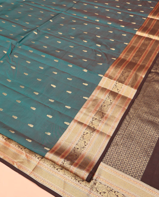 Blue Vasundhara Lite Silk Mix Saree, Detailed with Zari Buttas All Over Its Body, Complemented by Contrast Border of Rekku, Manga Mokku, and Kodi Visiry Designs, Grand Jaal Pallu and Paired with a Contrast Blouse