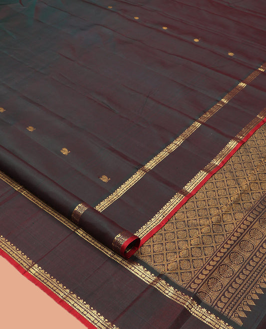 Brown Kanchipuram Silk Saree, Embellished with Mayil-Chakram Buttas, Highlighted by a Rettai Pettu Border, Grand Jaal Pallu, and Matching Blouse
