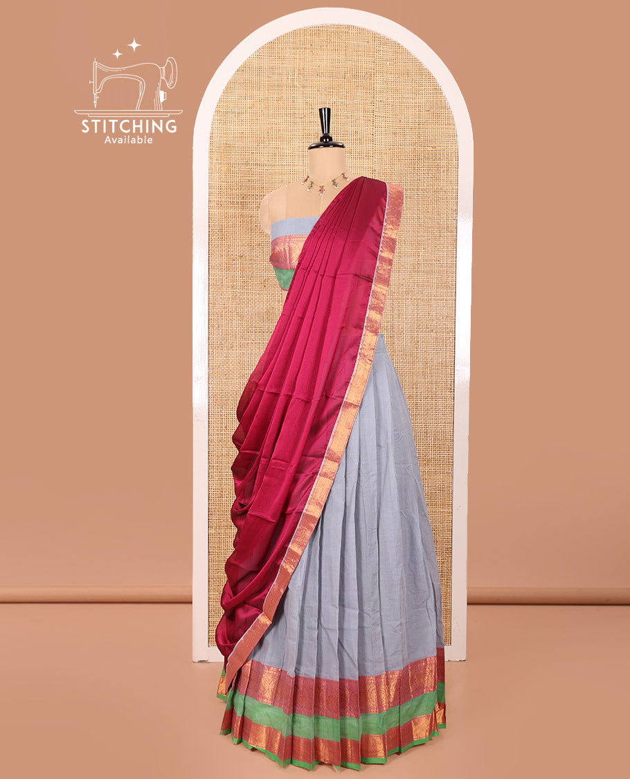 Grey and Rani Chettinad Cotton Half-Saree Featuring Plain Skirt, Adorned with a Contrast Traditional Zari Design Rettai Pettu Border of Peacock Designs, Paired with a Matching Blouse, and Contrast Satin Georgette Dhavani with Zari Border