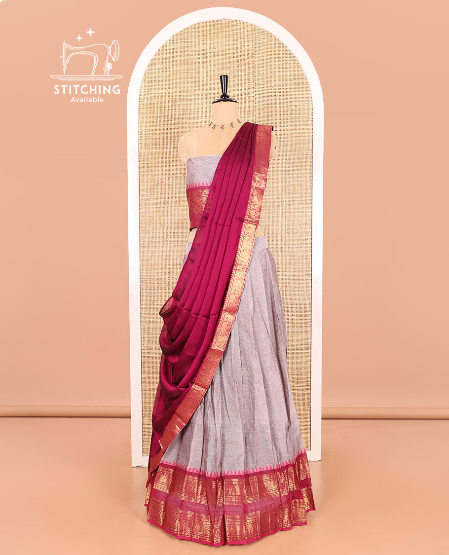 Steel Grey-Rani Pink Chettinad Cotton Half-Saree Featuring a Plain Skirt, Highlighted with a Contrast Peacock-Elephant Motifs Woven Rettai Pettu Zari Border, a Subtly Woven Matching Blouse, and a Vichitra Silk Contrast Traditional Zari-Bordered Dhavani
