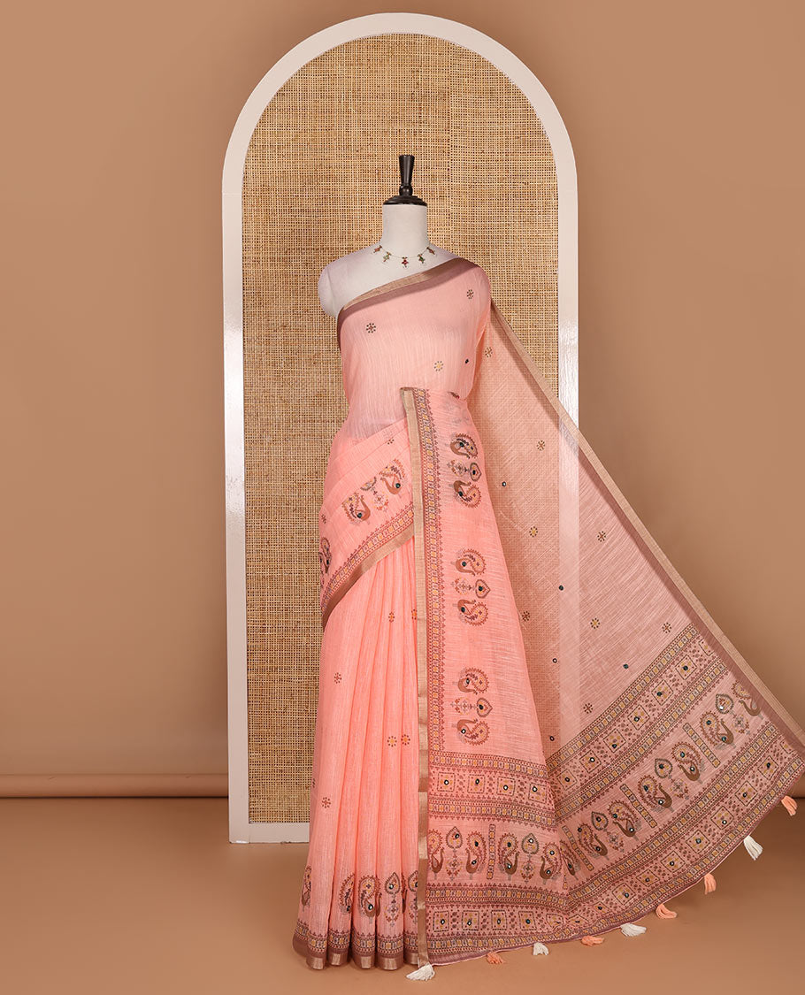 Orange buttas with mirror work linen saree, zari border with peacock motifs print, printed mirror work pallu, and matching blouse