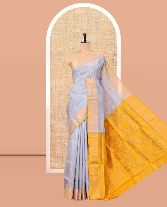 Grey Uppada Silk Saree, Subtly Sparkled with Buttas, Contrast Zari Border, Sparsely Motifs Woven Pallu, and a Contrast Blouse