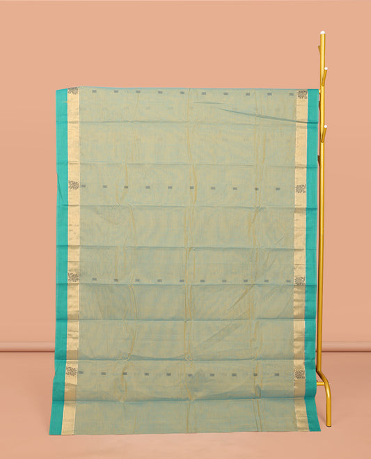 Green Kanchi Cotton Saree, Elevated with Buttas All Over Its Body, Complemented by a Contrast Border, Pallu of Intricate Design, and Paired with Matching Blouse