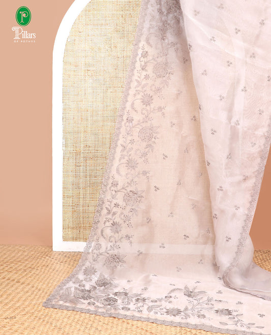 Light brown embroidered tissue organza saree with floral embroidery, scallop border & embroidery pallu along with embroidered blouse